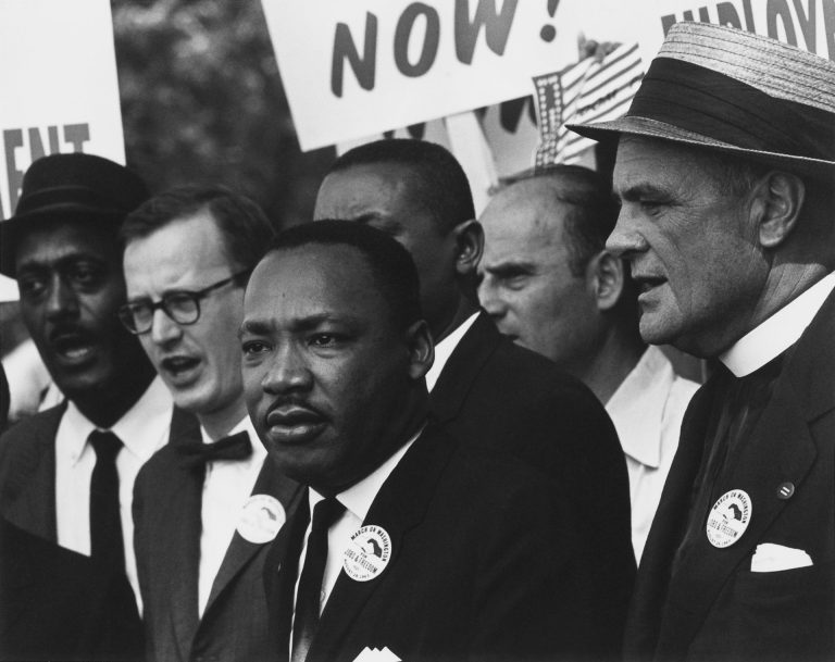 Empowering the Black Community Through Innovative Wealth-Building with Channels.biz 3 Civil Rights March on Washington D.C. Dr. Martin Luther King Jr. and Mathew Ahmann in a crowd. NARA 542015 Restoration