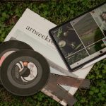 pictures on tablet on ground with disks and photographic films
