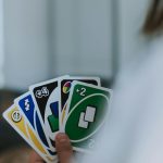 person holding uno cards