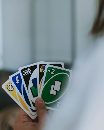 person holding uno cards