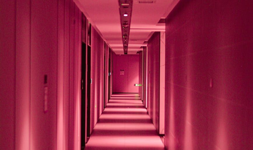 moody pink corridor with perspective depth