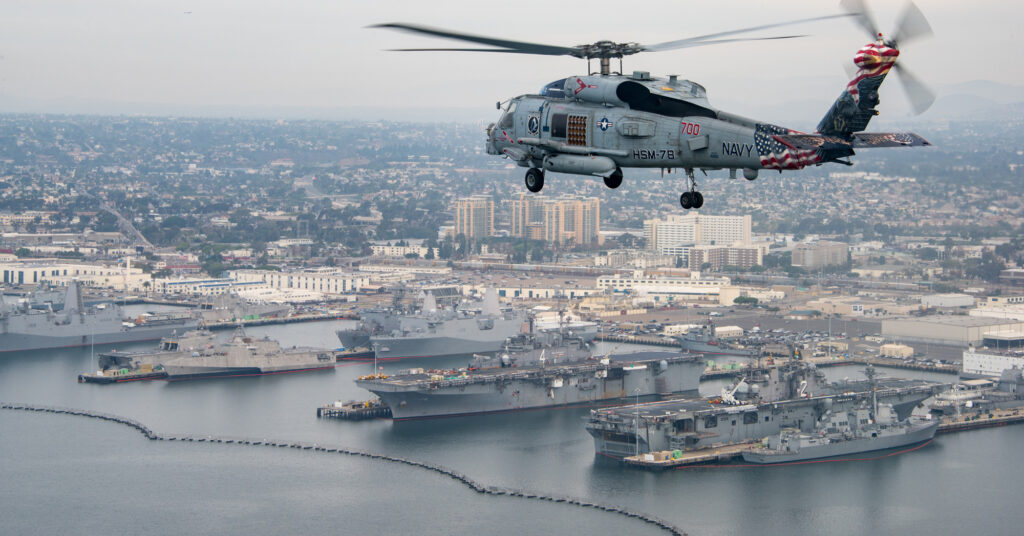 An MH 60R Sea Hawk helicopter flies over San Diego. 24546100368 cropped